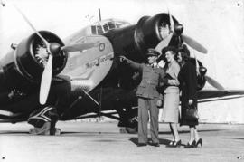 SAA Junkers JU-52 ZS-AJI 'Major Warden' with three people in the foreground.