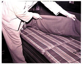 "1950. Bedding assistant at work."
