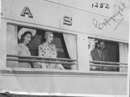 Cape Town, 21 February 1947. Royal family looking through the windows of the Royal Train.