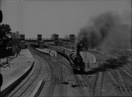 Johannesburg, 1936. SAR Class 16E No 858 with Union Limited leaving station.