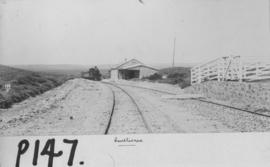 Centlivres, 1895. Cape 4th Class, later SAR Class 04 on train and station building in the distanc...