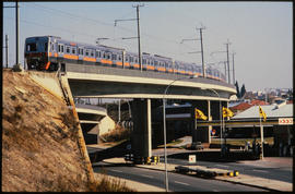 Johannesburg, 1984. SAR Class EMU type 6M suburban train on George Goch flyover bridge.