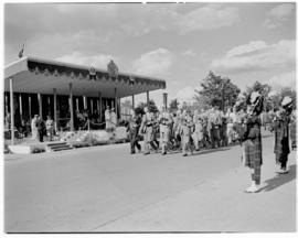 Bulawayo, Southern Rhodesia, 15 April 1947. Ex-servicemen remove their hats and march past the Ro...