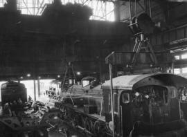 Cape Town, April 1947. Salt River locomotive workshop with SAR Class 19C No 247 being repaired.