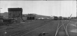 Grahamstown, 1895. Water tank and locomotive shed. (EH Short)