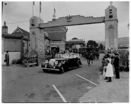 Pietermaritzburg, 18 March 1947. Royal family in open car passing under an arch at the station.
