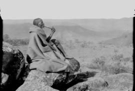 Transkei, 1932. Man of the Bomvaan tribe smoking a longstem pipe.
