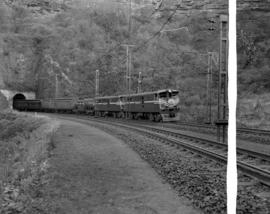 Natal, 1963. Passenger train No 192 'Trans-Natal' double-headed by SAR Class 5E's emerging from t...