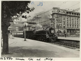 Johannesburg, 1938. SAR Class 23 with Union Limited in station.