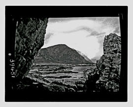 Hermanus, 1929. View through rocks.
