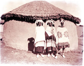 "Transkei, 1940. Three people at hut."