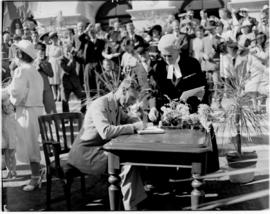 Port Elizabeth, 26 February 1947. King George VI signing the 'Golden Book' at St George's Park.