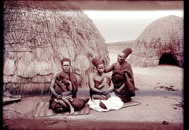 "Eshowe district, 1929. Zulu women with babies in front of hut."