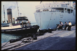 Cape Town, December 1968. SAR tug 'TS McEwen' with 'SA Vaal' in Table Bay Harbour. [S Mathyssen]