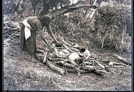 Natal South Coast, 1934. Preparing the fire for baking clay pots.