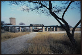 Etosha Game Park, Namibia, 1968.  SAR Guy tour bus entering Okaukuejo rest camp entrance gate.