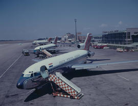 Johannesburg, 1967. Jan Smuts Airport. Three SAA Boeing 727 lined up on apron. ZS-DYO Vaal in for...