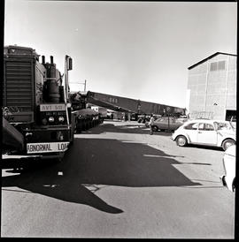 Pretoria, 1976. Abnormal load trailer being reversed into loading area by SAR International Pacif...