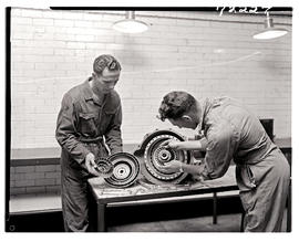 "Johannesburg, 1962. Apprentices assembling clutch and thrust bearing in Road Transport Serv...