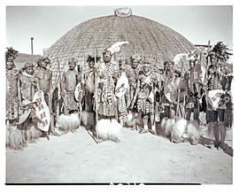 Natal, 1946. Zulu chief with his headmen in front of hut.
