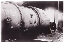 Circa 1900. Anglo-Boer War.  Bullet marks on locomotive boiler, first shots fired at Kraaipan.