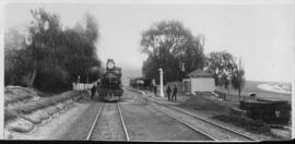 Cathcart, 1895. Cape 7th Class No 337 later SAR Class 7 at station with railwaymen posing in dist...