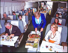 SAA Boeing 747 Interior. Cabin service. Food being served in first class. Steward.