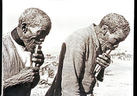Namibia, 1937. Two old Hottentot men playing reed flutes.