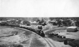 South-West Africa, 1937. Narrow gauge train hauled by SAR Class NG15  entering station.