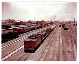 Springs, 1949. Station yard with SAR Class 12A No 1532 pushing goods wagons.