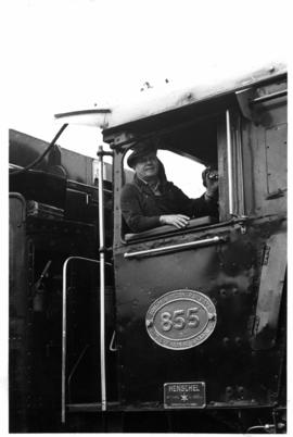 Johannesburg, April 1969. Driver in cabin of SAR Class 16E No 855 at Braamfontein.
