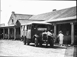 Vryburg, 1923. Loading milk cans at creamery onto Thornycroft three-axle truck at Central Hotel.