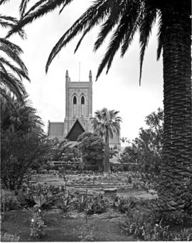 Port Elizabeth, 1950. Public gardens with church.