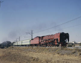 Bloemfontein district. SAR Class 26 No 3450 'Red Devil' with 'Drakensberg' Express.