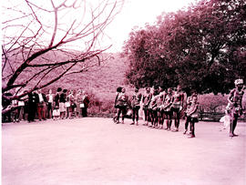 "Pietermaritzburg district, 1965. Zulu dancers with tourists."