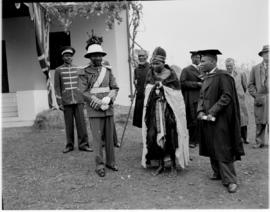 Swaziland, 25 March 1947. Paramount Chief Sobhuza II (with pith helmet) and local dignitaries.