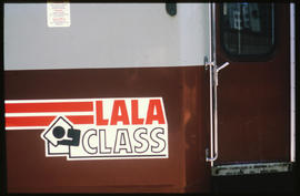 
'Lala Class' logo on side of coach.
