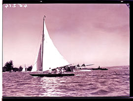 Durban, 1938. Yachting in Durban Harbour with a BOAC Short Empire G-AEUC 'Corinna' flying boat in...