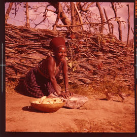 Eshowe district. Zulu woman grinding mealies in the Nkwaleni Valley.