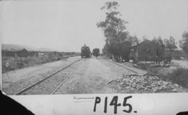 Sapkamma, 1895. Two trains at station with Cape 4th Class Stephenson, later SAR Class 04 on the l...