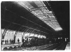 Cape Town, 1874. Station interior with R & W Hawthorn & Co No. 10 'Ebden' with a passenge...