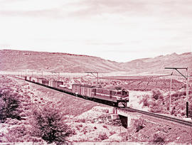 "De Doorns district, 1957. SAR Class 4E with passenger train approaching the N1 highway brid...