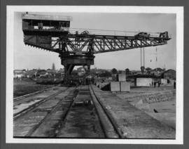 East London. Buffalo Harbour. 'Titan' crane placing blocks on the construction of breakwater.