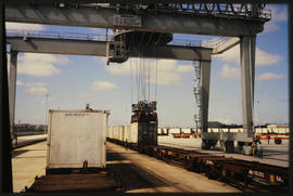 Cape Town, 1983. Overhead crane loading containers.