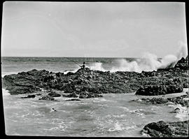 Hermanus, 1927. Angler on rocks.