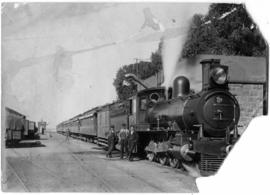 Modder River, 1904. Three men posing next to Cape 6th Class, later SAR Class 6J in station.