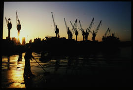 Durban, 1986. Durban Harbour cranes at sunset.