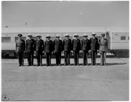 
Railways constables and officers stand to attention in front of the Royal Train.
