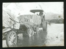Tractor with trailer fording drift.