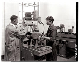 "Johannesburg, 1962. Apprentice testing diesel pump at Road Transport Services workshop at L...